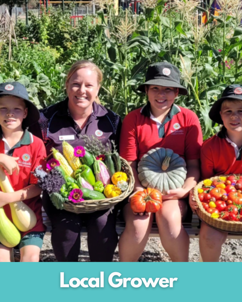 Children and adult with fresh produce outdoors.