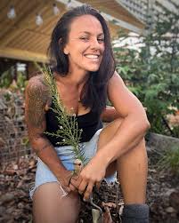 Smiling woman gardening in outdoor setting