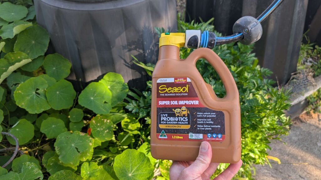 Seasol Super Soil Improver bottle in garden