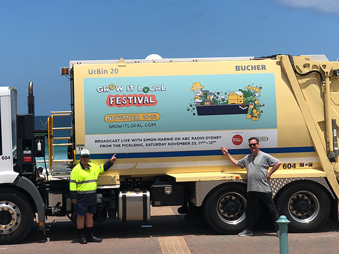 Garbage truck advertising Grow It Local Festival event.