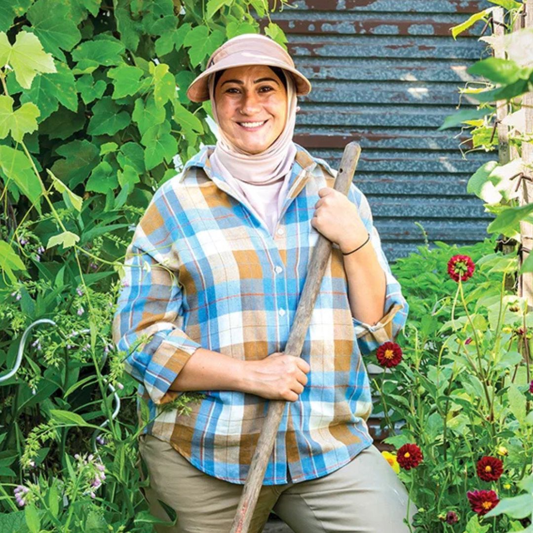 Woman gardening in a lush garden