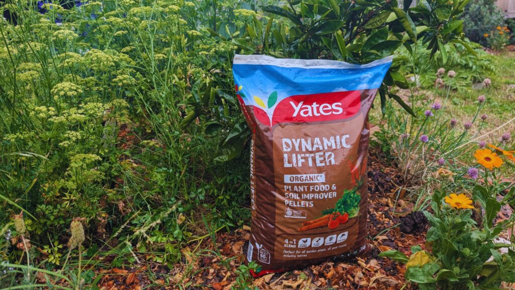Dynamic Lifter organic plant food bag in garden