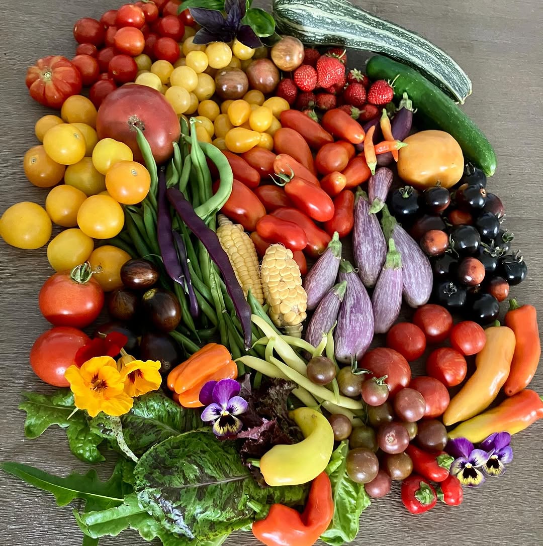 Colourful fresh vegetables and flowers on display